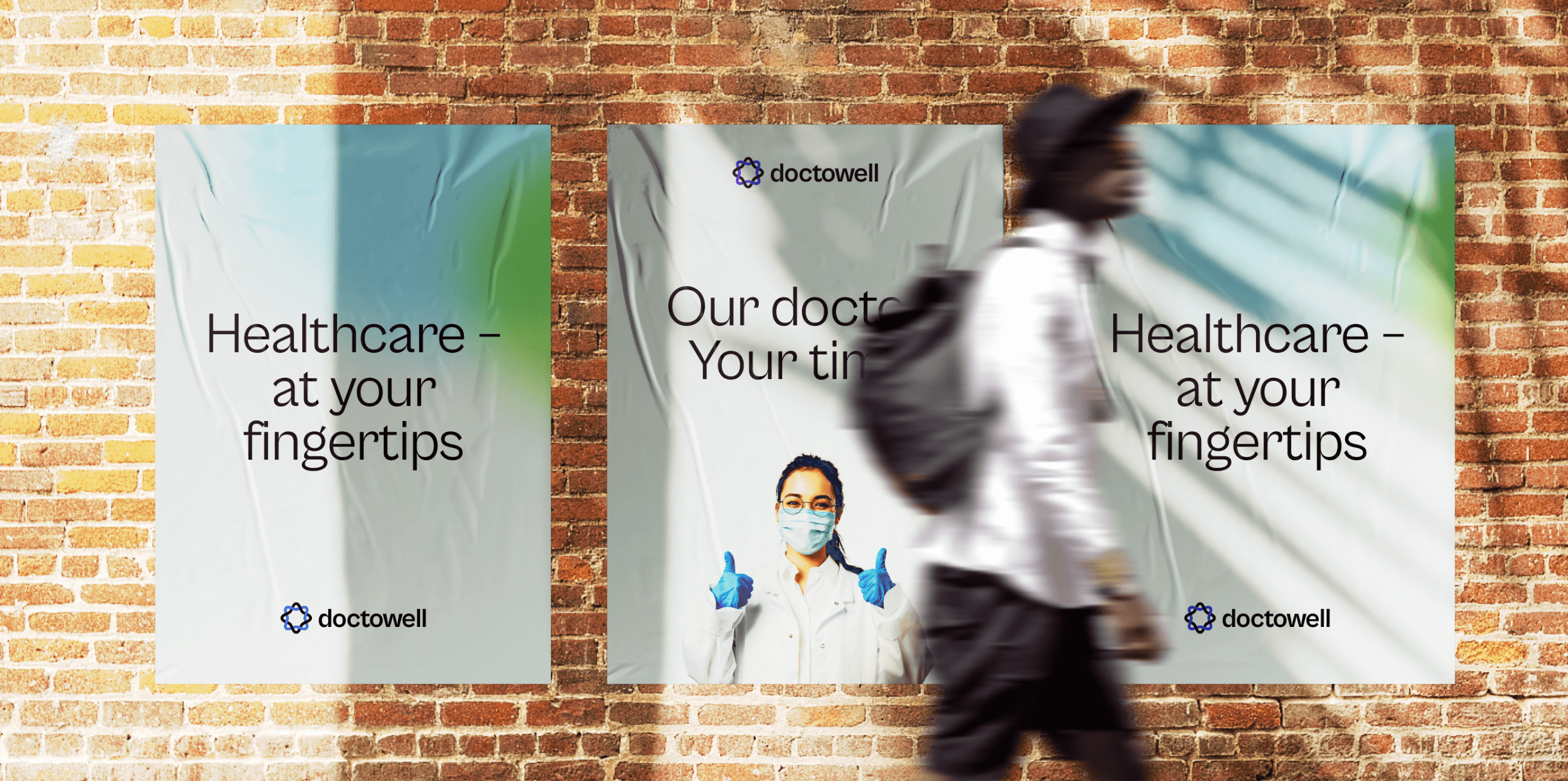 Doctowell brand posters applied to a street mockup